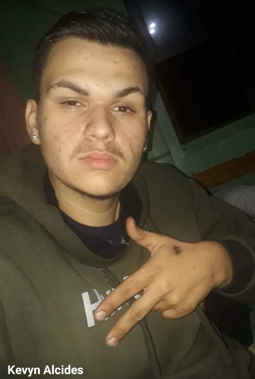 MAN BEING EXECUTED BY GROUP DRESSED AS POLICEMEN