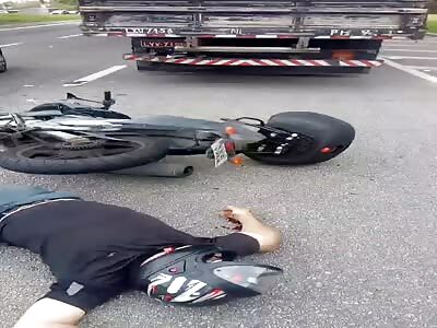 RIDER DYING IN THE ROAD