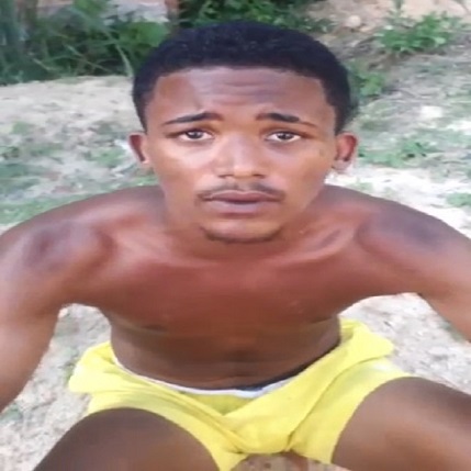 YOUNG MAN BEING EXECUTED WITH HOE