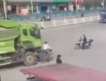 Biker run over by  Truck