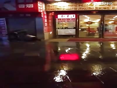 Man kicks woman in front of Restaurant.