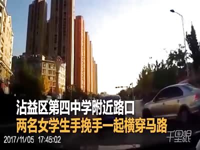 Two girls holding hands while running across the street is hit by a car 