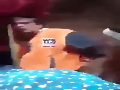 Thief beaten and take off his shoes