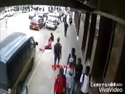 Woman coiled by car parked