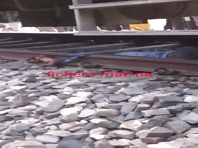 Dead man under train