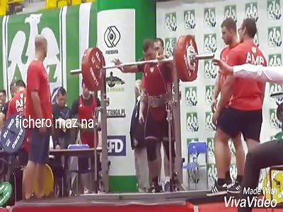 Man lifts the weight and his legs do not support the weight