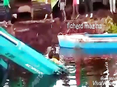 DEATH IN WATER: drowned man is taken out of water by rescuers