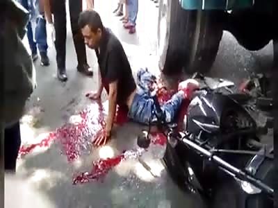 Man tries to stand up after being crushed by truck