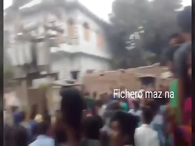 man hanging on electric wires