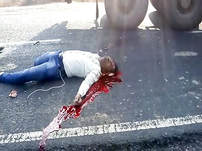 MAN NUDGED IN ASPHALT