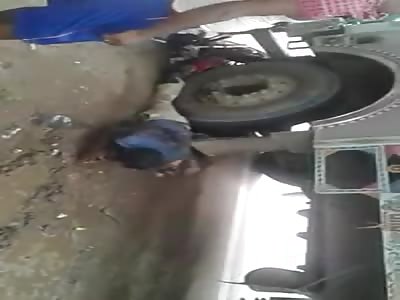 MOTORCYCLE CRUSHED UNDER TRUCK (Still Alive)