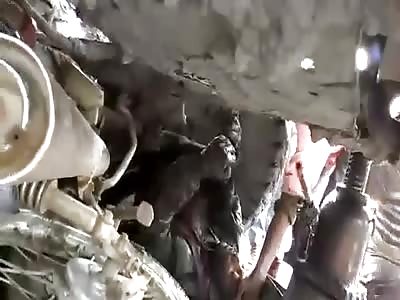 MOTORCYCLE IS RESCUED UNDER THE BUS