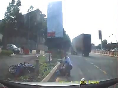 MOTORCYCLE IS STAMPED WITH TRUCK WHEEL AND FALLS