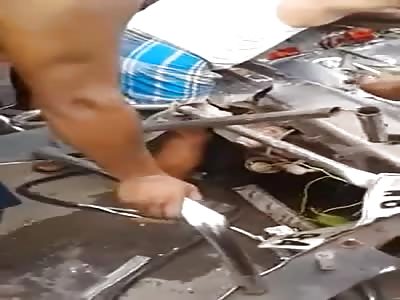 MAN IS TRAPPED IN HIS CART