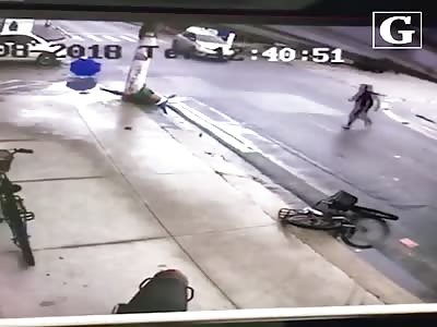 Motorcyclist Struck by Car and Crashes Into a Pole