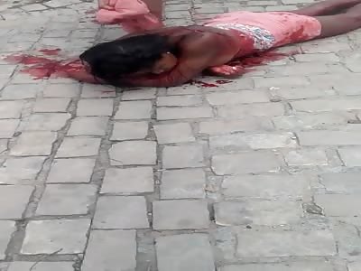 Woman Stabbed in the Back by Her Husband Dying on the Street