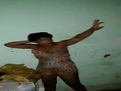 Violent Beating of a Woman in the Slums Using Boards. 