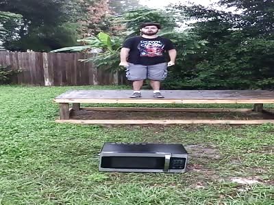 Idiot tries to crush microwave oven.