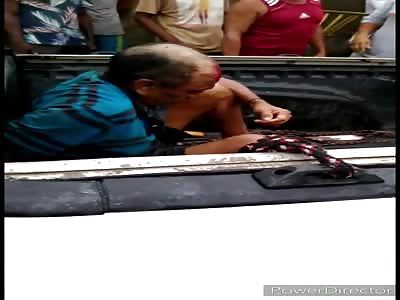 Captured criminal receives beating.