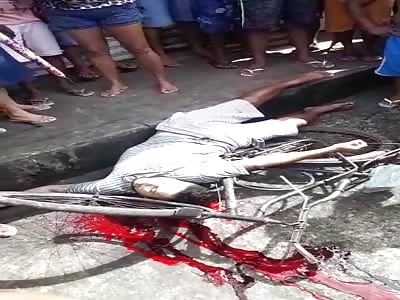 dead cyclist with head shot