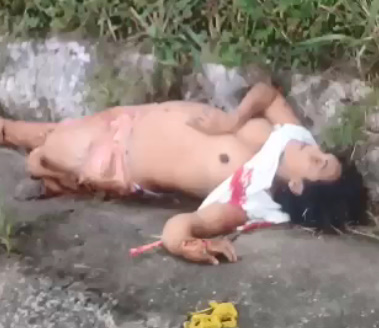 Man and woman's bodies on the roadside.