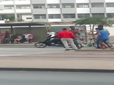 Black dude gets naked and beated in daylight