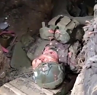 A pair of killed ORCs inside of a dugout