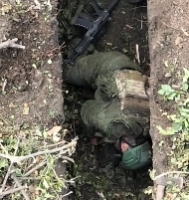 A drone drops multiple munitions on a ORC trench
