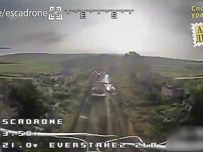 A kamikaze drone kisses a Russian tank