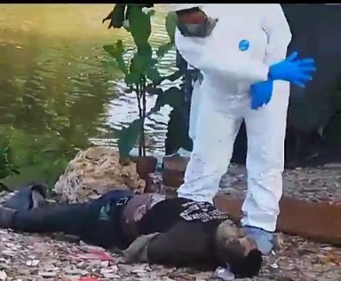 BOUND ARMS BODY FOUND IN DECOMPOSITION STATE 