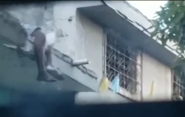 Haitian gang keep shooting on dead man legs 