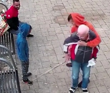 Mugrants molest and rob an elderly disabled man.