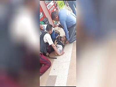 Gunfire exchange between armored truck guards and assailants.