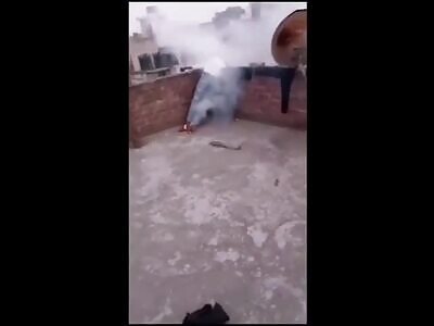 An Indian young man is electrocuted on the roof of his house