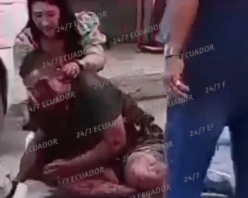 Wife holding her husband victim of hitman shoot 