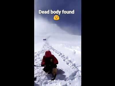 Tourists film a small avalanche with two bodies rolling