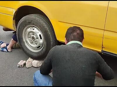 Old man falls off his scooter and gets dragged under a van