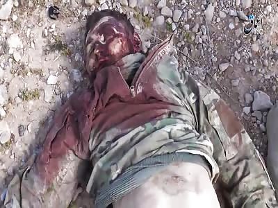 Corpse and Equipment of Russian Mil Adviser Near Palmyra