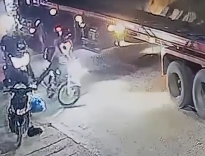 Inebriated Biker Falls Under Truck Wheels