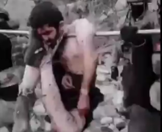 Turkish soldiers transporting shattered body of pkk fighter 