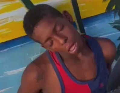 Ecuadorian police punishing arrested criminal 