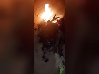 naked thief being burned