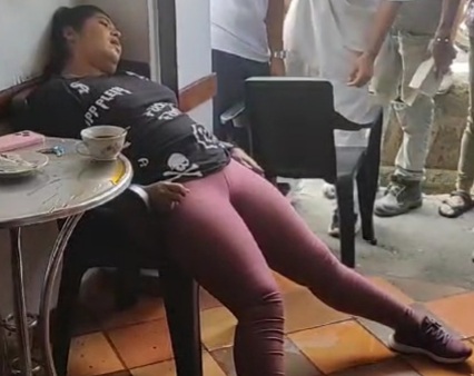 Woman Enjoying Coffee Executed by Sicario 