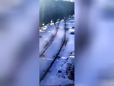 Russian man lets train wheels do the work