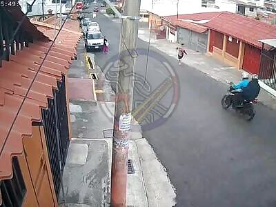 Dude clumsily tries to escape from hitmen on a motorcycle