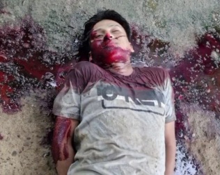 Dead body with hands tied and gunshot wounds to the head.