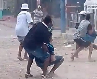 Two gangs fighting with stones 