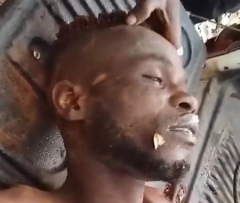 Nigerian army showing dead terrorist body killed during fight 