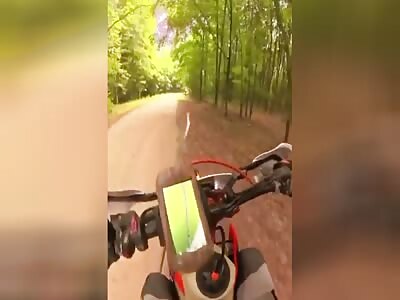 Motorcycle driver has his foot skewered by a branch 