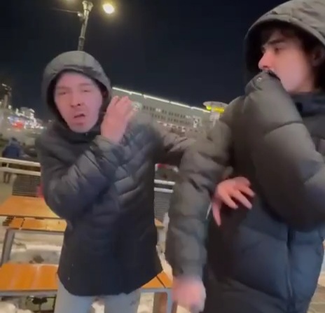 migrants brutally and mockingly beat a disabled person.